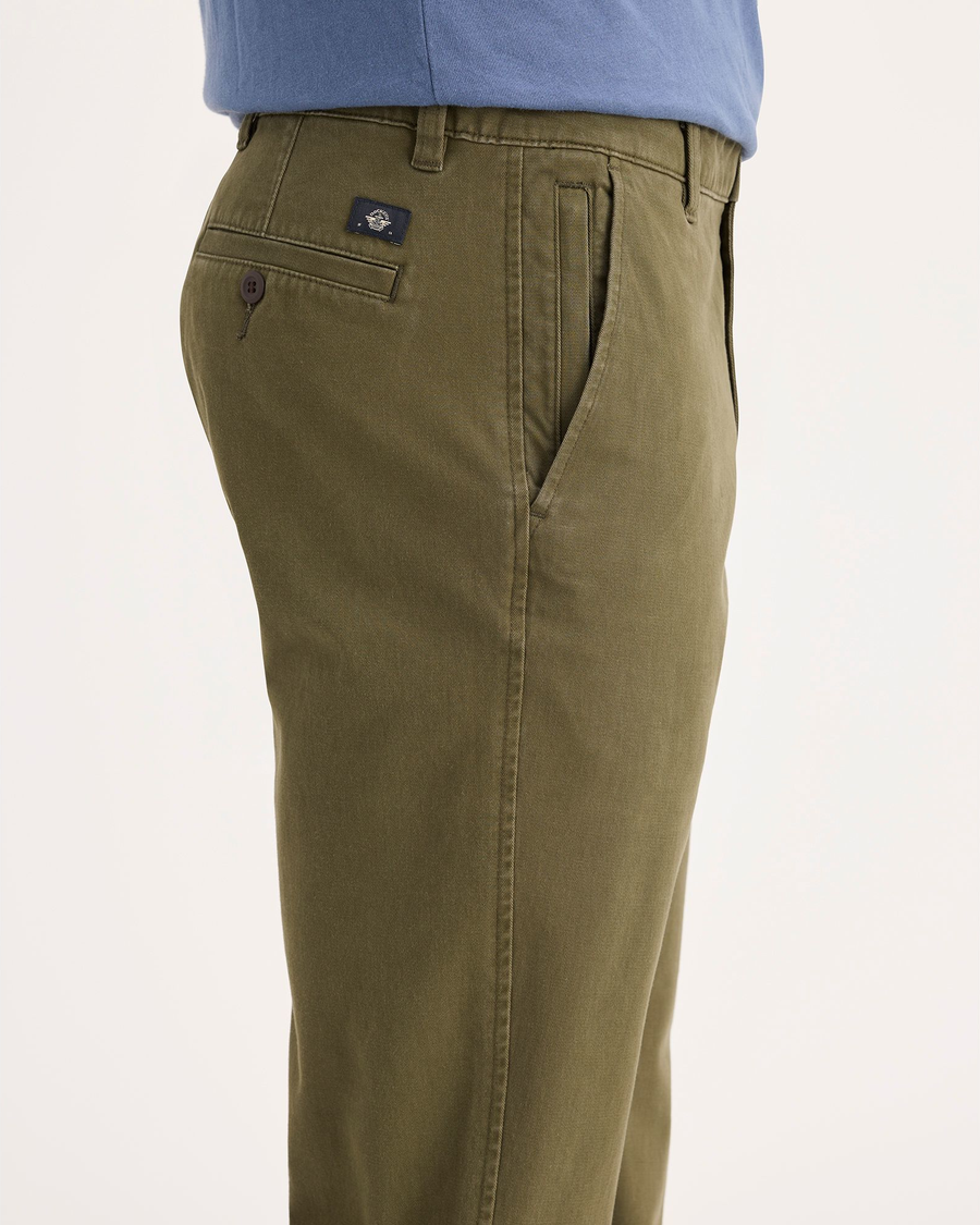 Side view of model wearing Army Olive Ultimate Chinos, Slim Fit.
