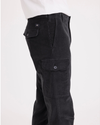 Side view of model wearing Asphalt Men's Slim Tapered Fit Cargo Pants.