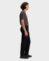 Side view of model wearing Beautiful Black Alpha Chino Pants, Straight Fit.