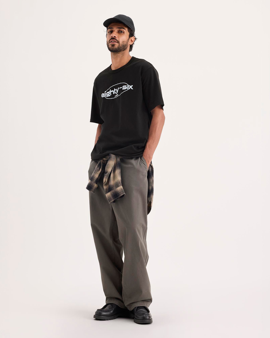 Front view of model wearing Beautiful Black Eighty-Six Crewneck Tee, Relaxed Fit.