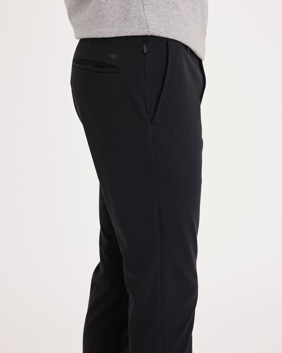 Side view of model wearing Beautiful Black Go Chino, Skinny Fit.