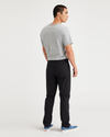 Back view of model wearing Beautiful Black Jean Cut Go, Slim Tapered Fit with Airweave.