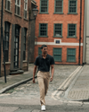 View of model wearing Beautiful Black Men's Slim Fit Signature Go Khaki Pants.