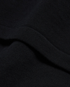 View of model wearing Beautiful Black Sweater Polo, Relaxed Fit.