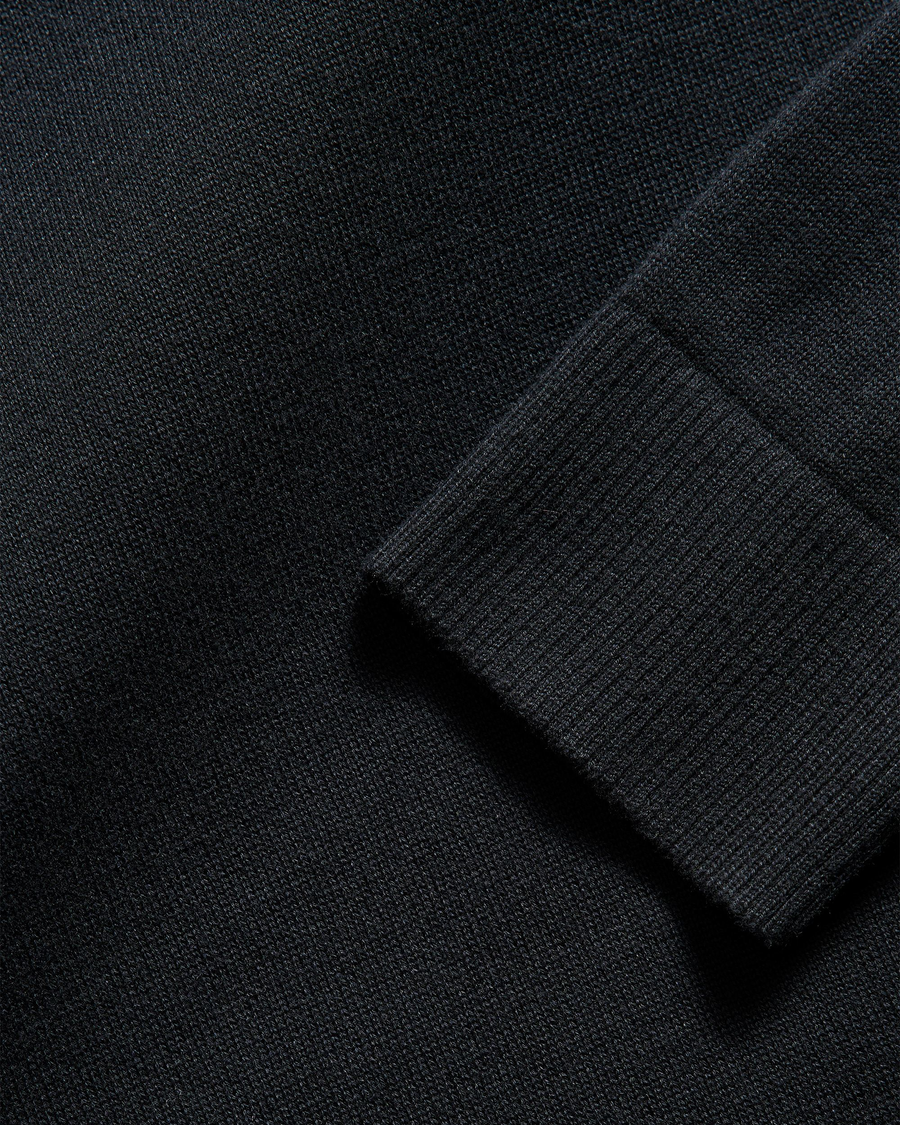 View of model wearing Beautiful Black V Neck Sweater.