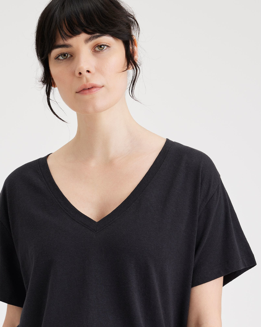 View of model wearing Beautiful Black Women's Deep V-Neck Tee Shirt.