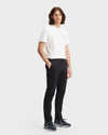 Front view of model wearing Black Men's Slim Fit Smart 360 Flex Alpha Chino Pants.