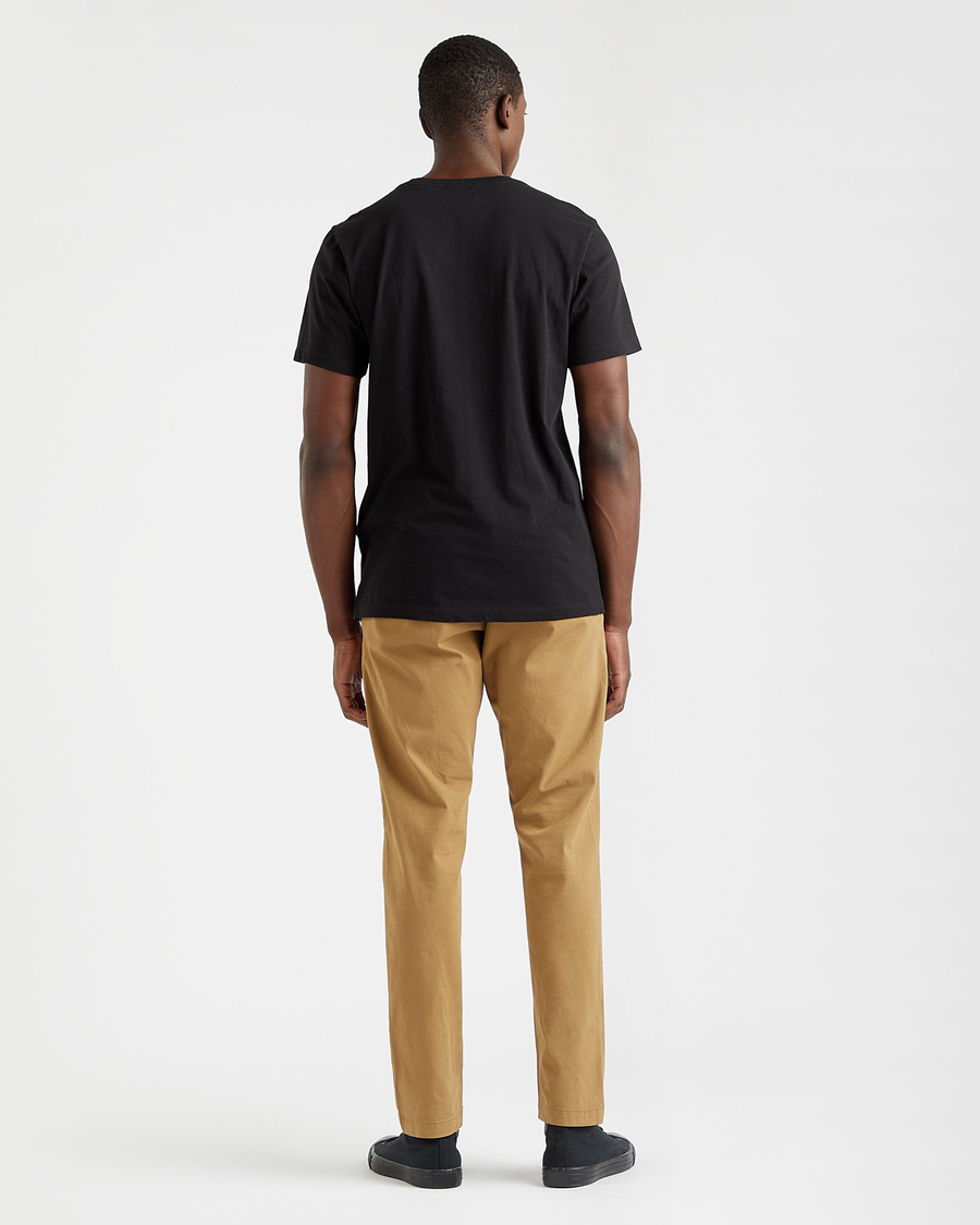 Back view of model wearing Black Stencil Graphic Tee, Slim Fit.