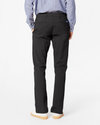 Back view of model wearing Black Ultimate Chinos, Slim Fit.