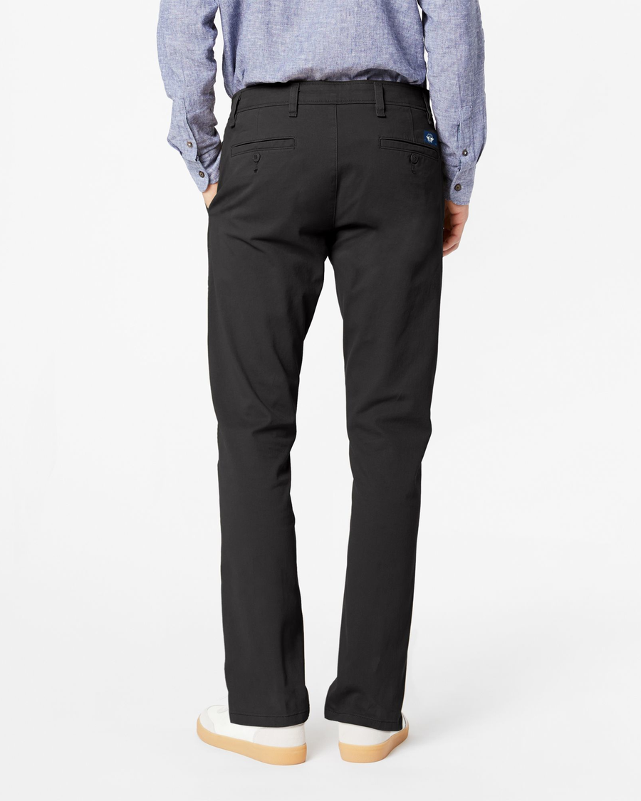 Back view of model wearing Black Ultimate Chinos, Slim Fit.