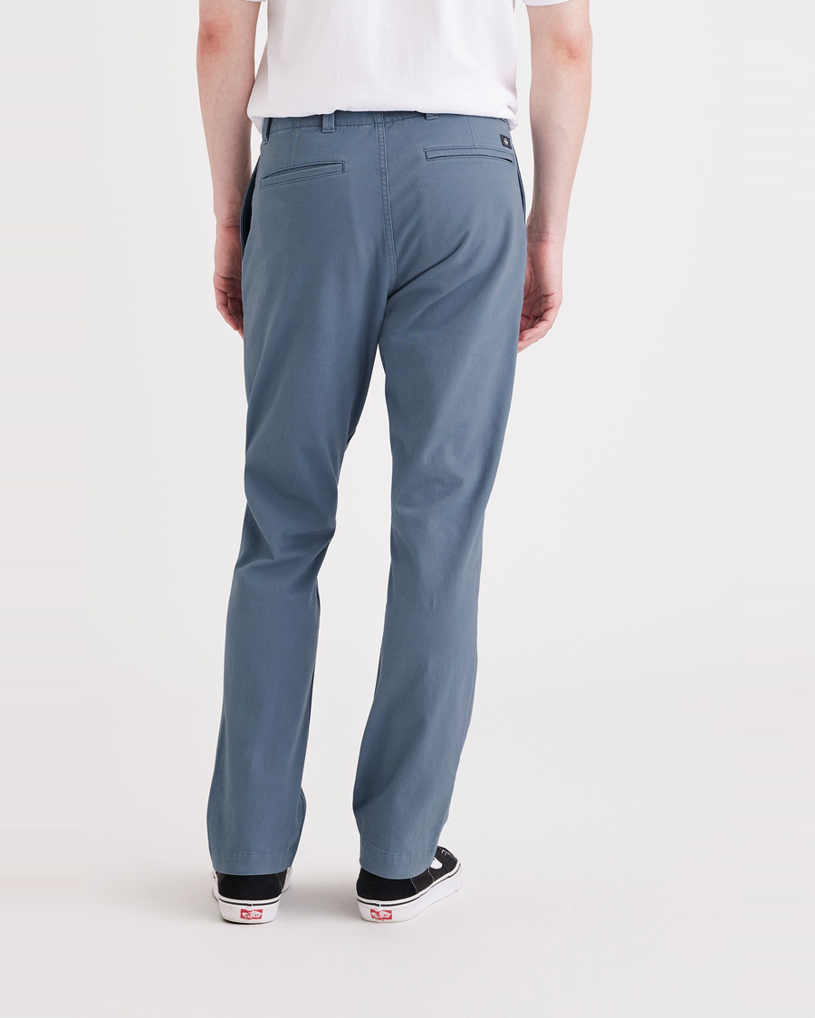 Back view of model wearing Bluefin Men's Slim Fit Smart 360 Flex California Chino Pants.