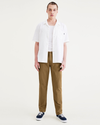 Front view of model wearing Bronze Brown Alpha Chino Pants, Slim Fit.