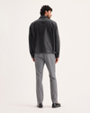 Back view of model wearing Burma Grey Signature Iron Free Khakis, Skinny Fit with Stain Defender®.