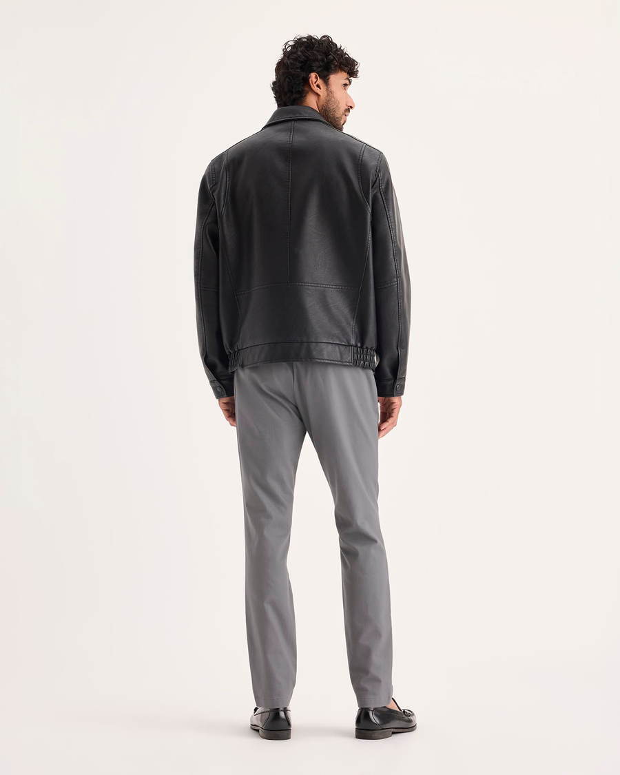 Back view of model wearing Burma Grey Signature Iron Free Khakis, Skinny Fit with Stain Defender®.