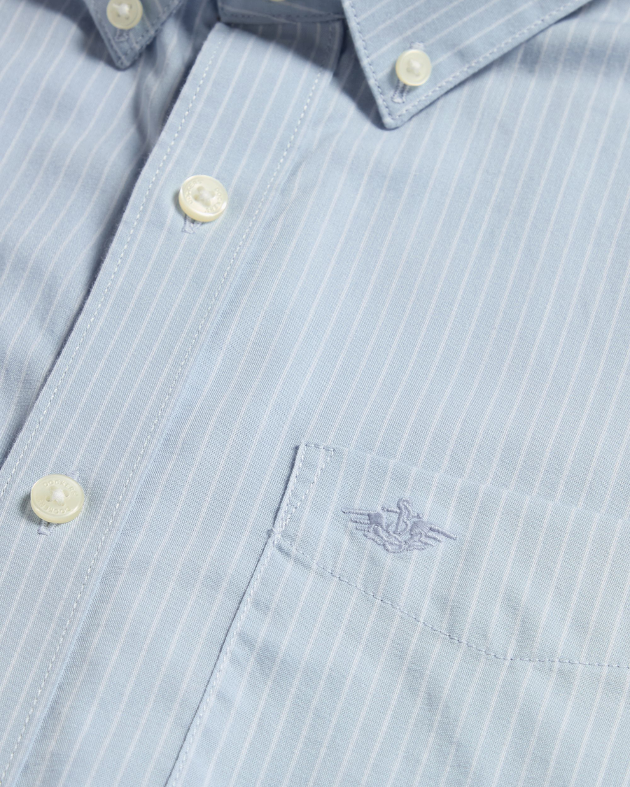 View of model wearing Burnett Subdued Blue Signature Shirt Long Sleeve with Stain Defender®, Slim Fit.