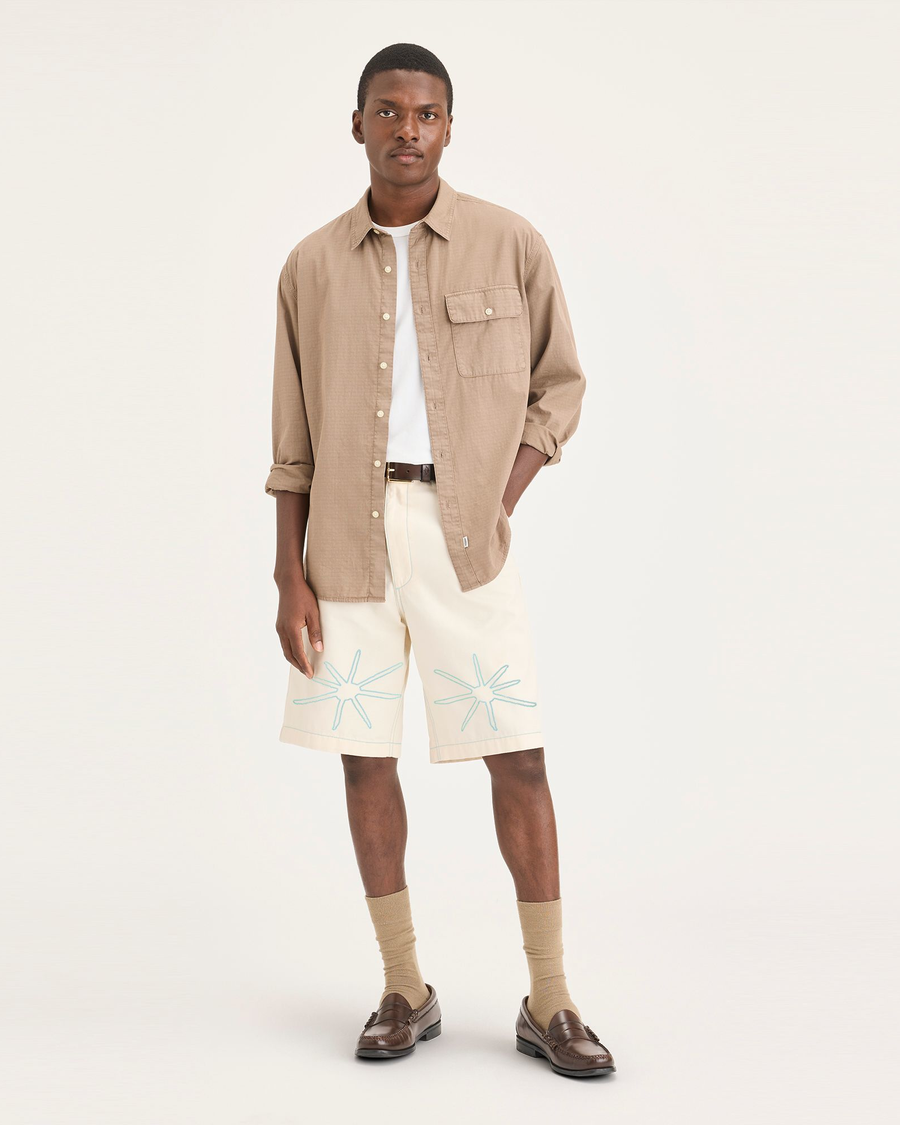 Front view of model wearing Buttercream Eighty-Six 10" Shorts, Loose Fit.