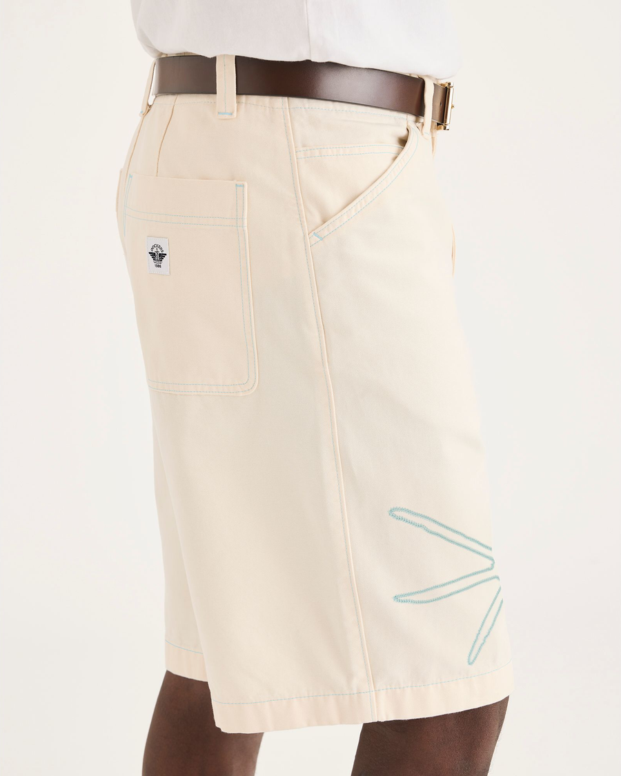 Side view of model wearing Buttercream Eighty-Six 10" Shorts, Loose Fit.