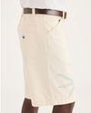 Side view of model wearing Buttercream Eighty-Six 10" Shorts, Loose Fit.