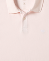 View of model wearing Calcite Pique Polo, Slim Fit.