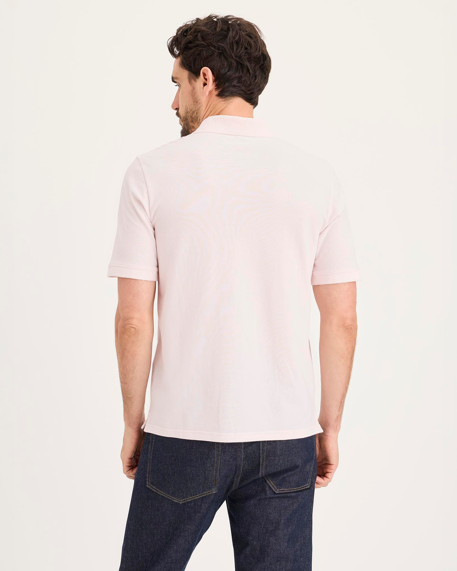 Back view of model wearing Calcite Pique Polo, Slim Fit.