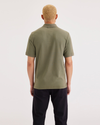 Back view of model wearing Camo Men's Slim Fit Original Polo Shirt.