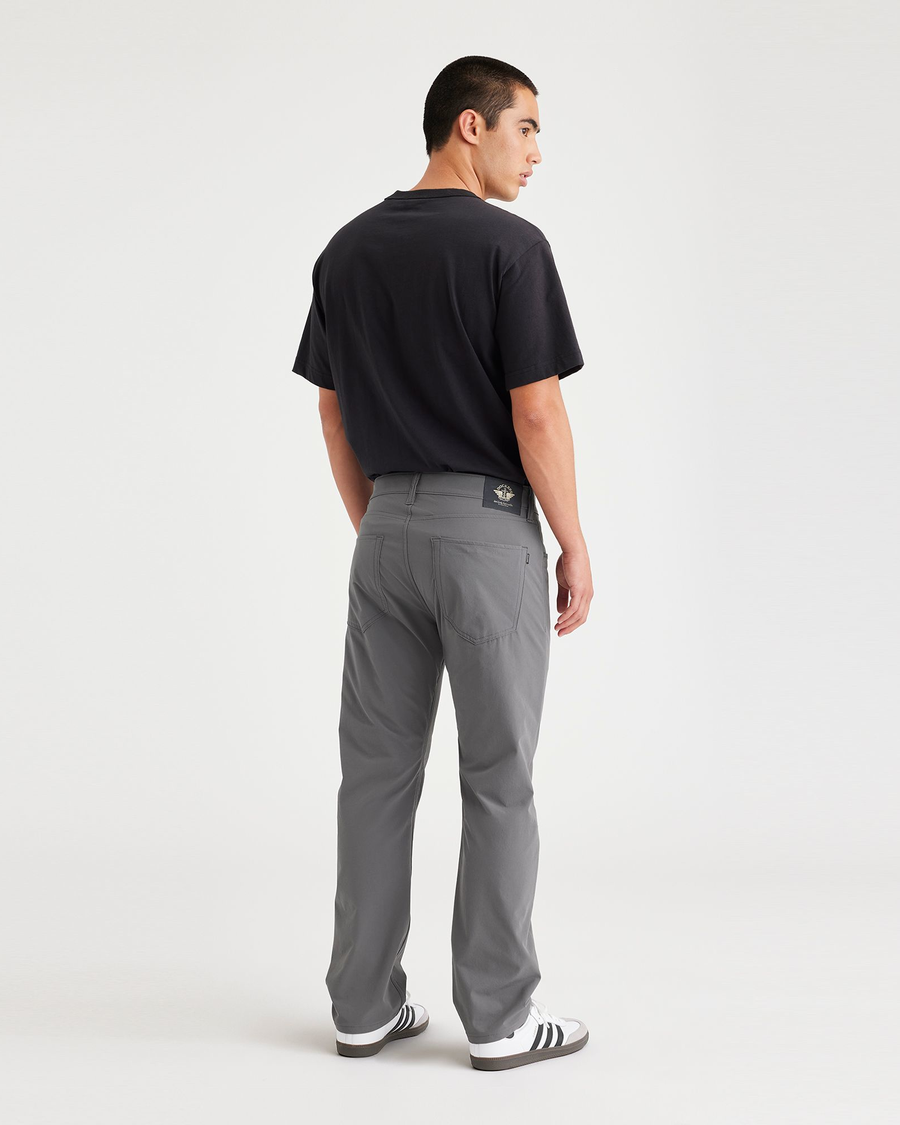 Back view of model wearing Car Park Grey Jean Cut Go, Slim Fit.