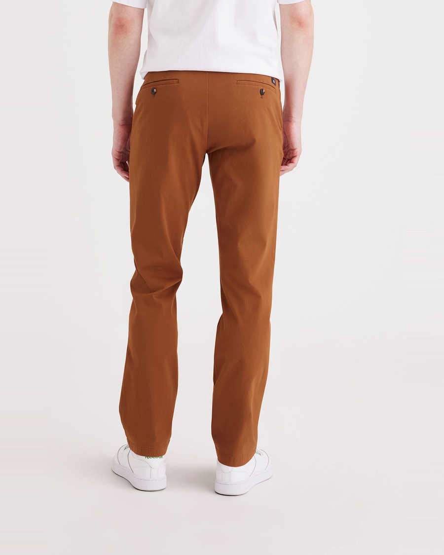 Back view of model wearing Caramel Café Men's Slim Fit Smart 360 Flex Alpha Chino Pants.