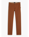 Front view of model wearing Caramel Café Men's Slim Fit Smart 360 Flex Alpha Chino Pants.