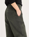 Side view of model wearing Chimera Blake Chino, High Straight Fit.