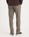 Back view of model wearing Chocolate Chip Crafted Khaki Pants, Slim Fit.