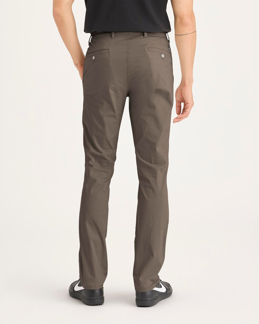 Back view of model wearing Chocolate Chip Original Chino Pants, Skinny Fit.