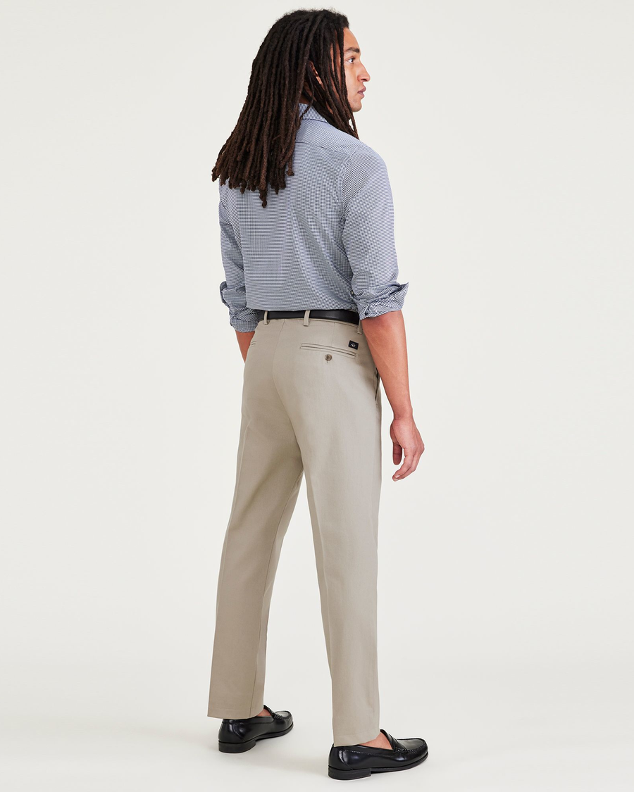 Back view of model wearing Cloud Signature Iron Free Khakis, Creased, Slim Fit with Stain Defender®.