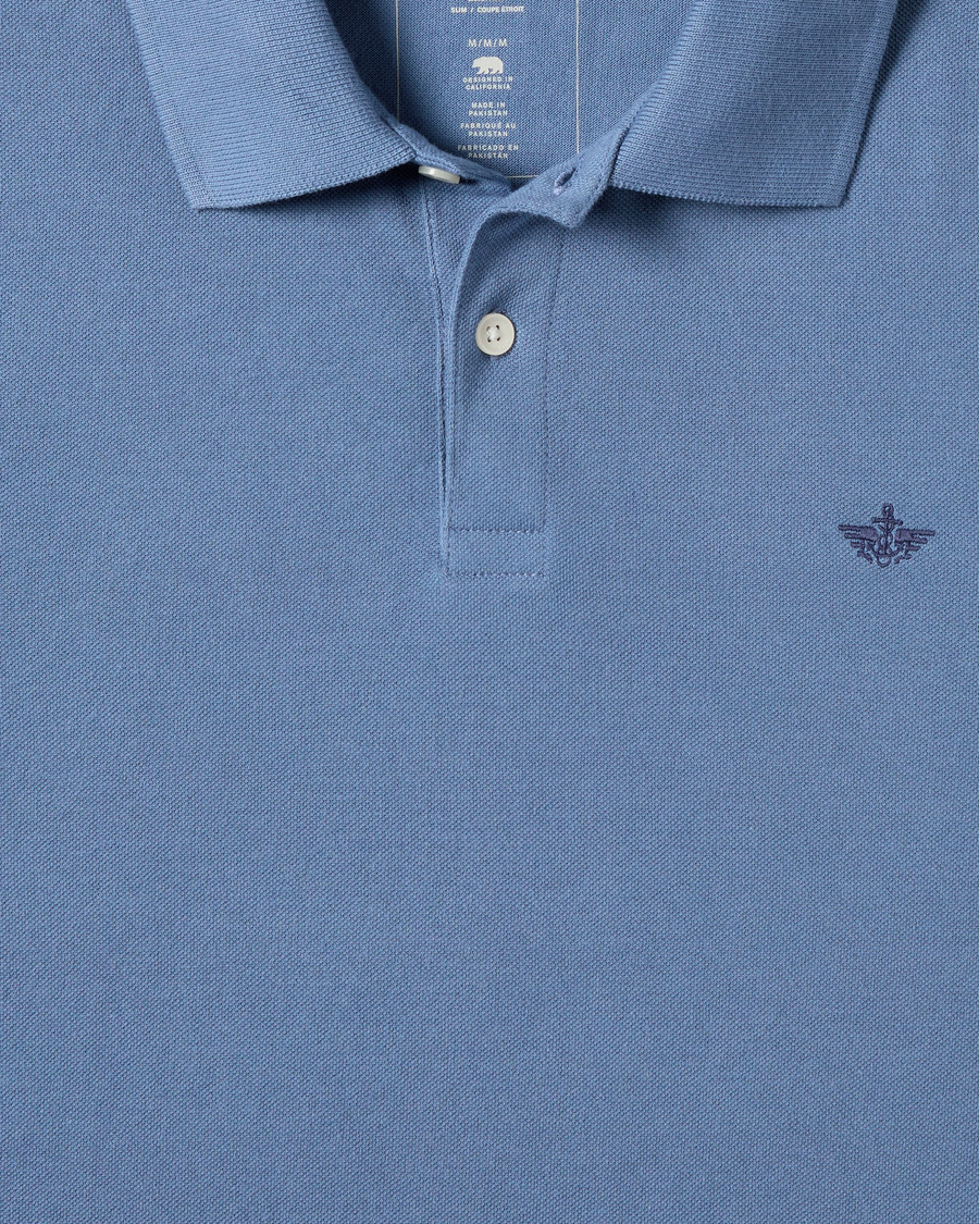 View of model wearing Coastal Fjord Pique Polo, Slim Fit.