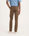 Back view of model wearing Coffee Liquer Alpha Chino Pants, Skinny Fit.