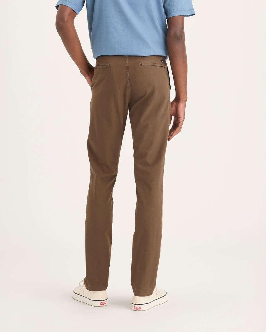 Back view of model wearing Coffee Liquer Alpha Chino Pants, Skinny Fit.
