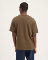 Back view of model wearing Coffee Liquer Eighty-Six Tee, Relaxed Fit.