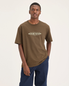 Front view of model wearing Coffee Liquer Eighty-Six Tee, Relaxed Fit.