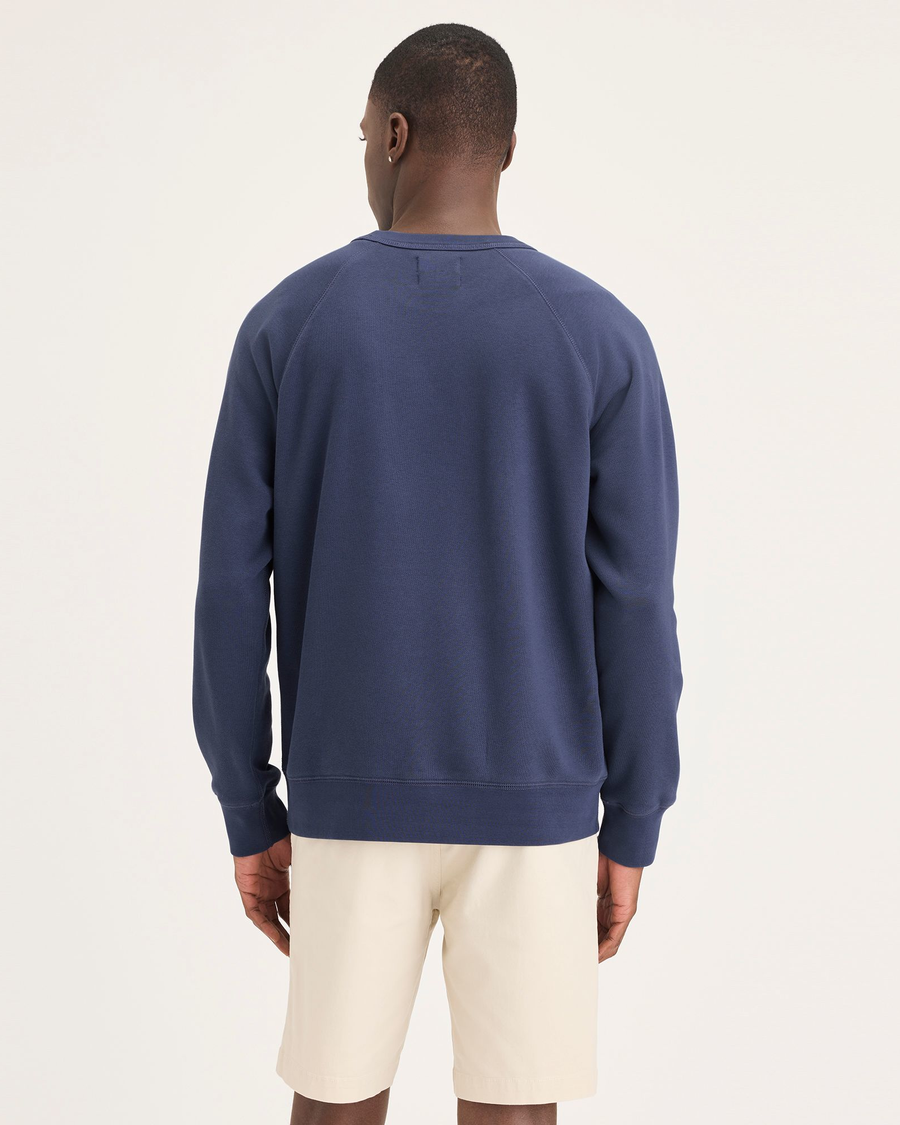 Back view of model wearing Crown Blue Men's Regular Fit Icon Crewneck Sweatshirt.