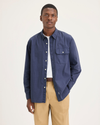 Front view of model wearing Crown Blue Men's Relaxed Fit Eighty-Six Shirt.