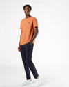 Front view of model wearing Dockers Navy Men's Skinny Fit Supreme Flex Alpha Khaki Pants.