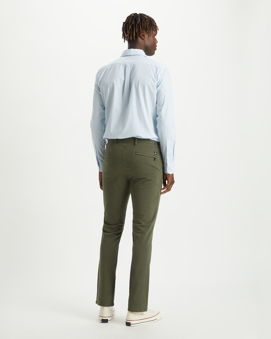 Back view of model wearing Dockers Olive Men's Skinny Fit Smart 360 Flex Alpha Khaki Pants.