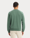 View of model wearing Duck Green Icon Crewneck Sweatshirt, Regular Fit.