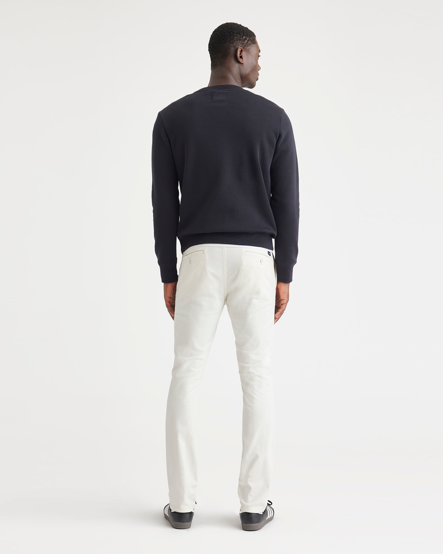 Back view of model wearing Egret Men's Skinny Fit Original Chino Pants.