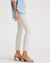 Side view of model wearing Egret Women's Skinny Fit Chino Pants.