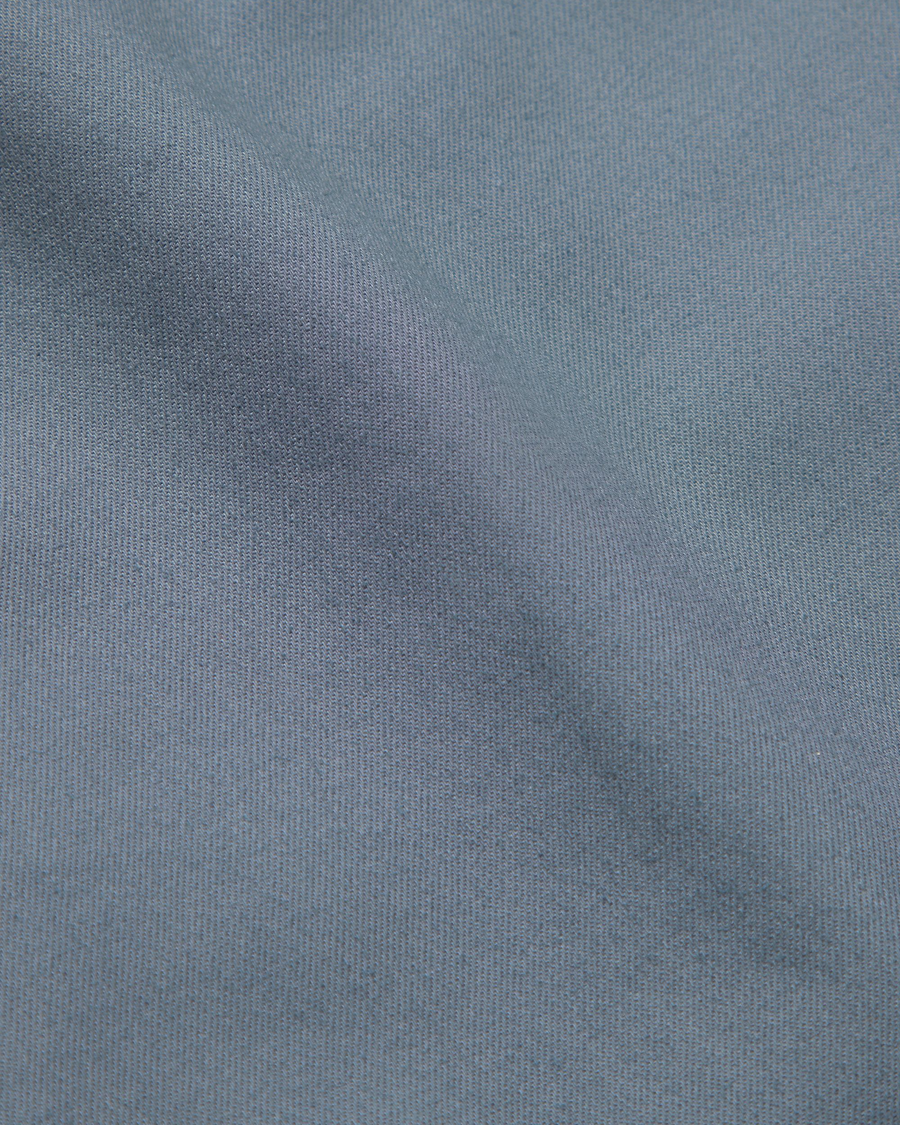 View of model wearing Folkstone Gray Signature Iron Free Khakis, Slim Fit with Stain Defender®.