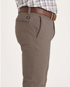 Side view of model wearing Fossil Alpha Chino Pants, Skinny Fit.