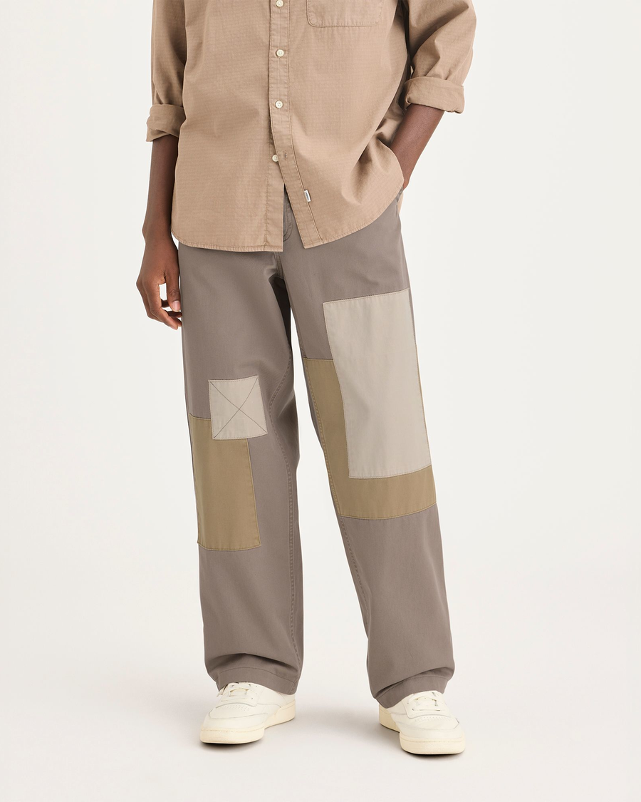 Front view of model wearing Fossil Eighty-Six Alpha Chino Pants, Loose Fit.