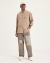 Front view of model wearing Fossil Eighty-Six Alpha Chino Pants, Loose Fit.