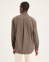 Back view of model wearing Fossil Garment Dye Men's Relaxed Fit Eighty-Six Shirt.