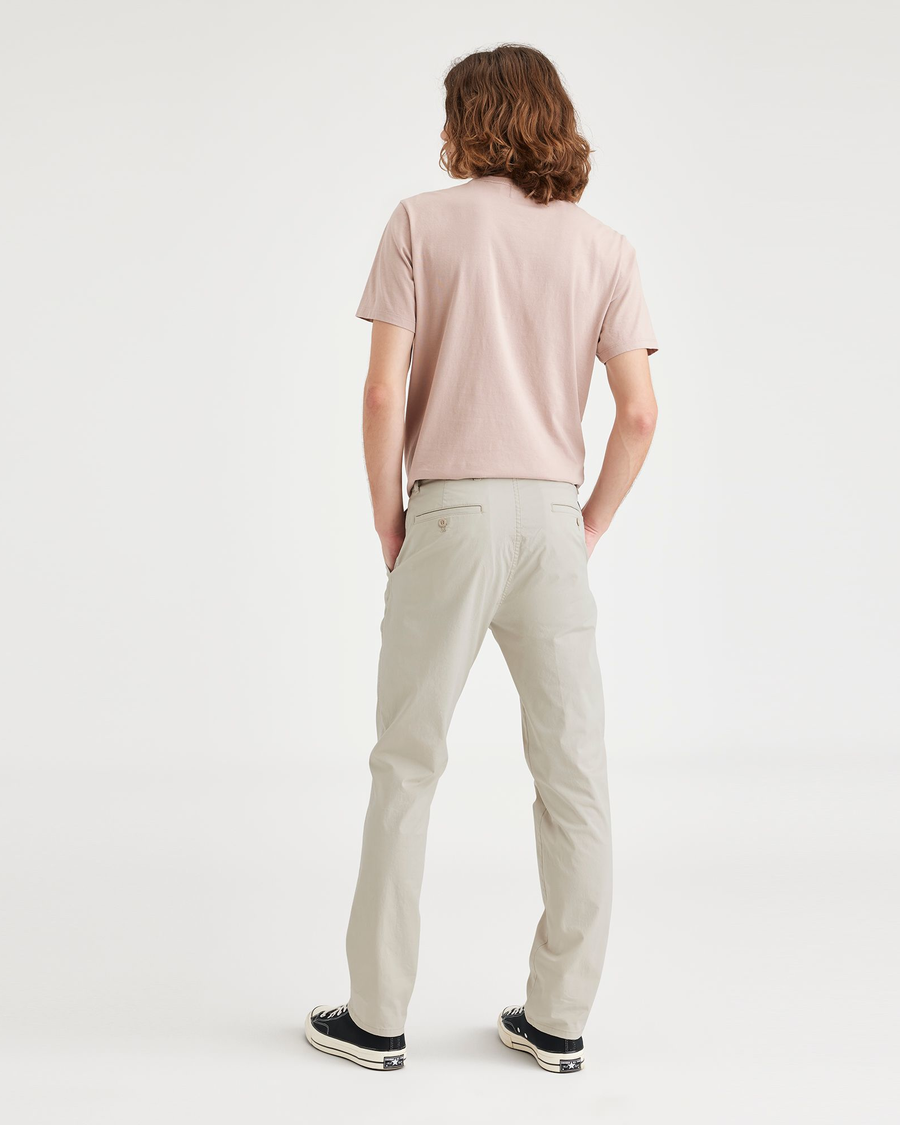 Back view of model wearing Grit Men's Slim Fit Original Chino Pants.